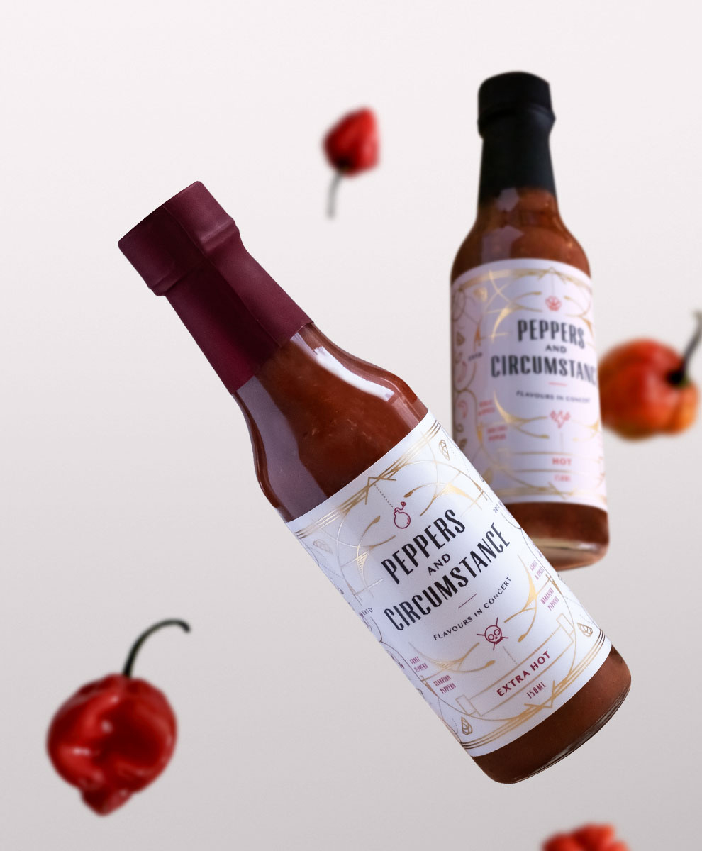 Peppers and Circumstance bottles floating with peppers